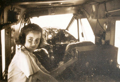 Mary in the cockpit of the Bellanca plane.
