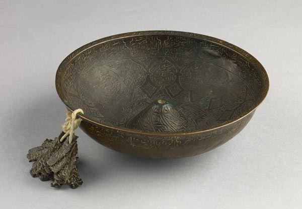 Magic bowl with attached prayer tablets