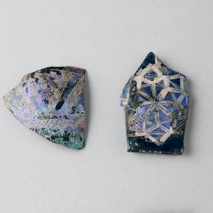 Iridescent glass vessel fragments