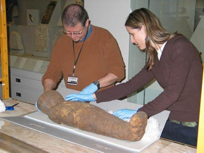 Placing the mummy in a case