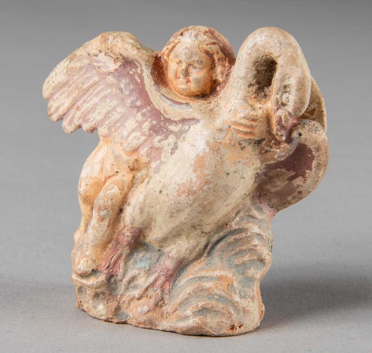 Eros and a swan figurine
