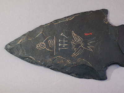 Inscribed projectile point-shaped slab