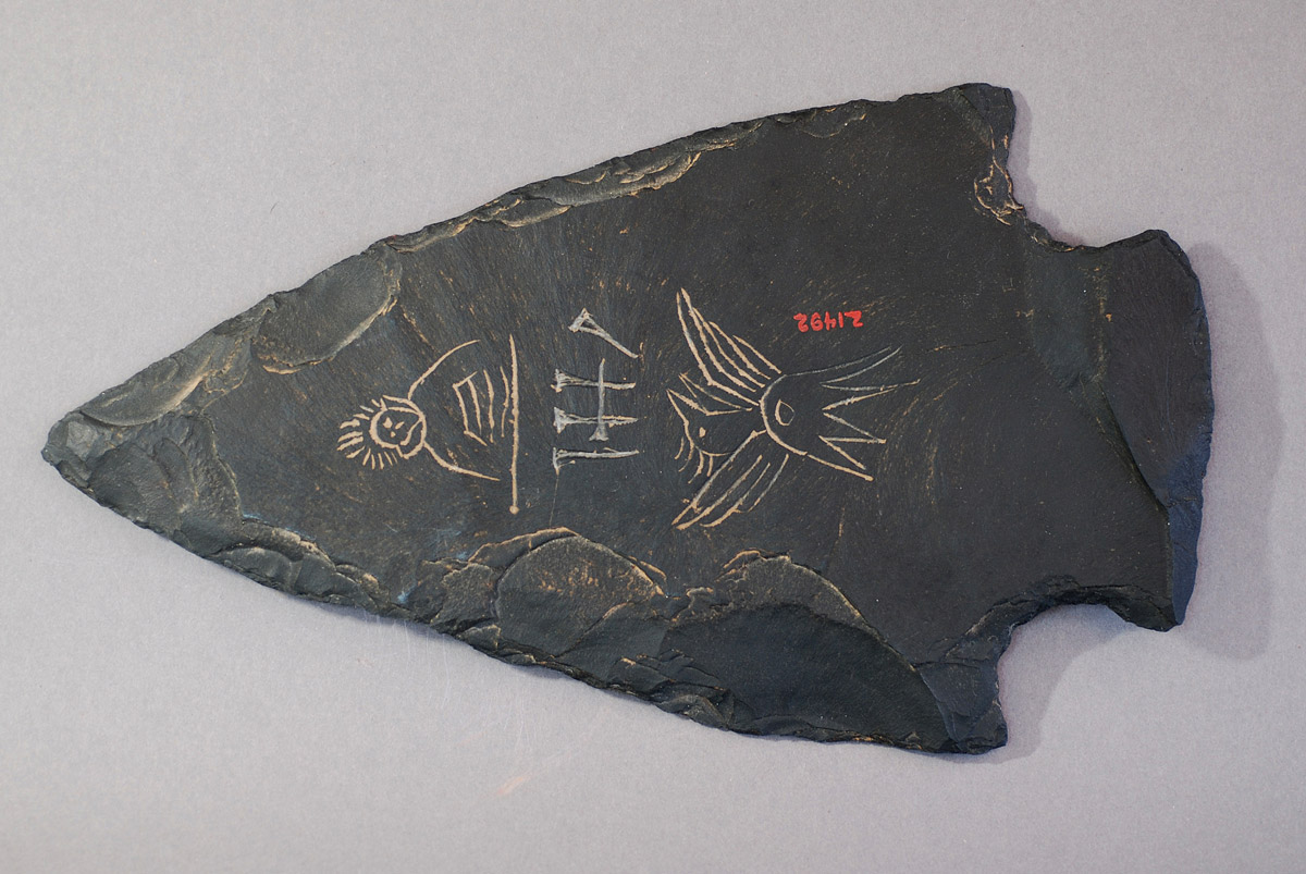 Inscribed projectile point-shaped slab