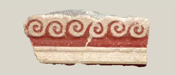 Stucco fragments with running wave motif