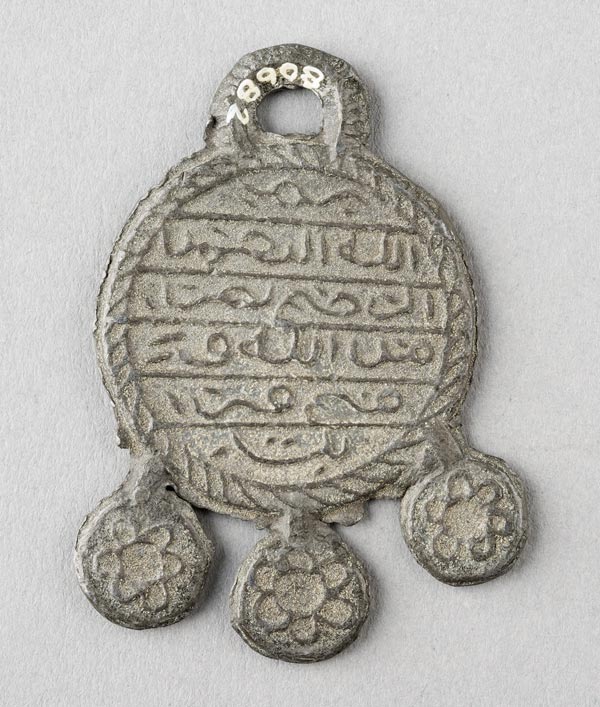 Amulet with five-pointed star, reverse