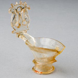 Pouring spout and ornate thumb rest